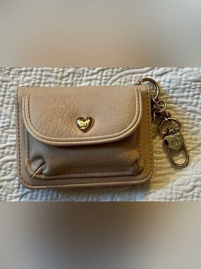 Juicy Couture wallet with clasp.  Beige/lightest faux pink Leather Label